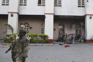 Chadian soldiers walk in front of a building that Boko Haram insurgents used as their base before being driven out by the Chadian military in Dikwa March 2, 2015. Chadian troops have driven Boko Haram militants out of the northeast Nigerian town of Dikwa, losing one soldier in the battle, an army spokesman said on Monday.  Photo: Reuters.