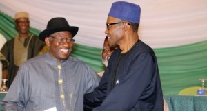 Nigerian President Goodluck Jonathan (L) and APC main opposition party's presidential candidate Mohammadu Buhari (R) smile after signing the renewal of the pledges for peaceful elections on March 26, 2015 in Abuja. Security is a major concern at Saturday's vote both from Boko Haram violence against voters and polling stations to clashes between rival supporters. In 2011, around 1,000 people were killed in violence after Jonathan beat Buhari to the presidency. AFP PHOTO / PHILIP OJISUA