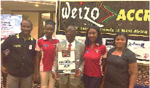 Adjei (with plaque) and some of his staff when he collected his West African Personality award at Accra Weizo.
