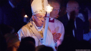 Pope leads procession with only one candle