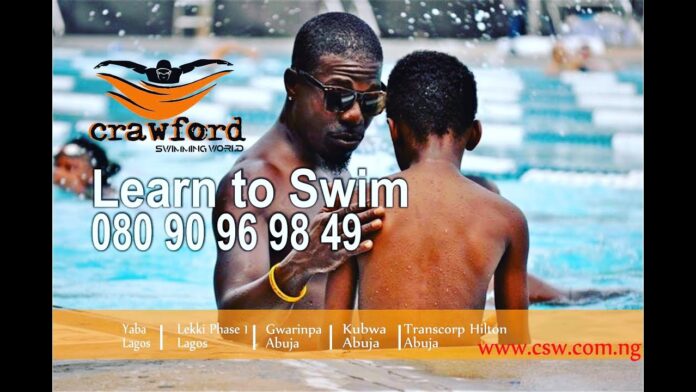 Swimming-Lesson. Boy and Man in pool. Lagos