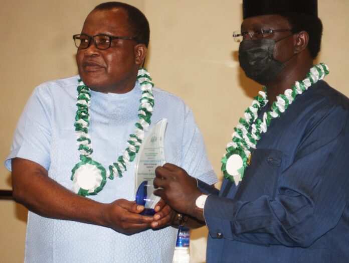 Wabba-Ngige holding plaque NLC