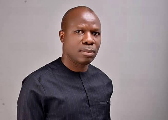 David Ojei lights a candle at UNN