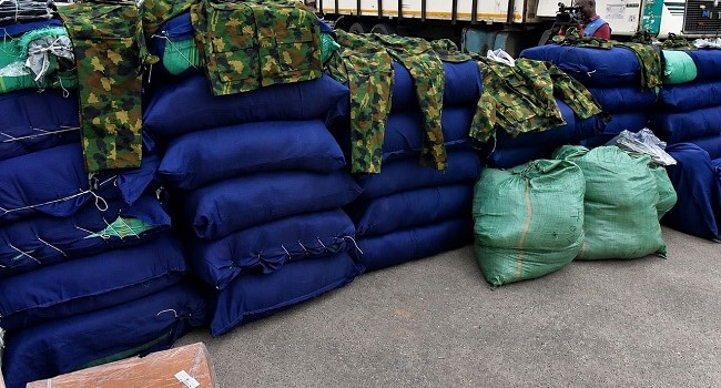 VIDEO: Police intercept truck carrying 47 sacks of military camouflage in Lagos, as Fashola calls for stronger law enforcement